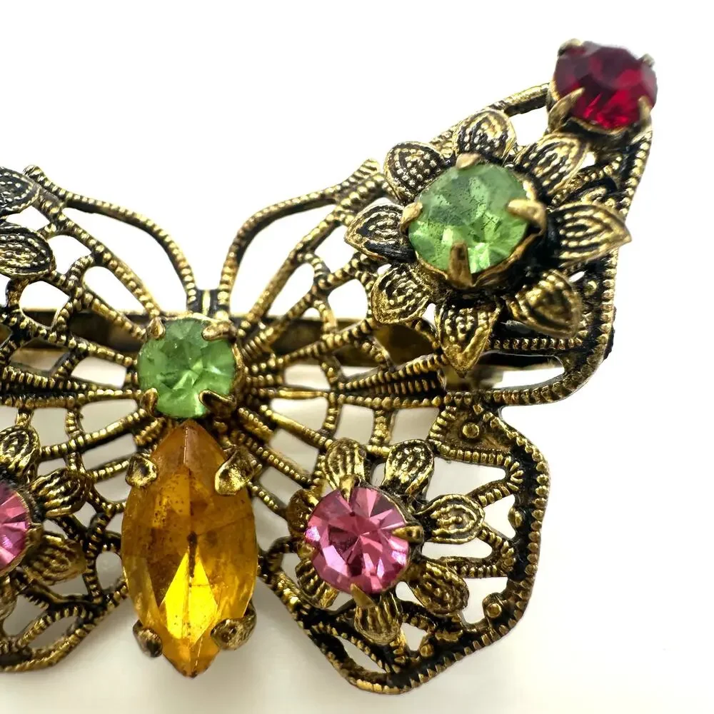 Vintage gold tone filigree multicolor prong set rhinestones butterfly brooch